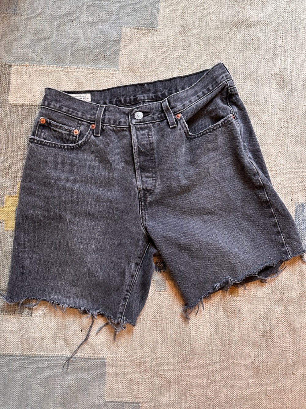 Levi’s Raw Hem Black Denim Cutoff Shorts